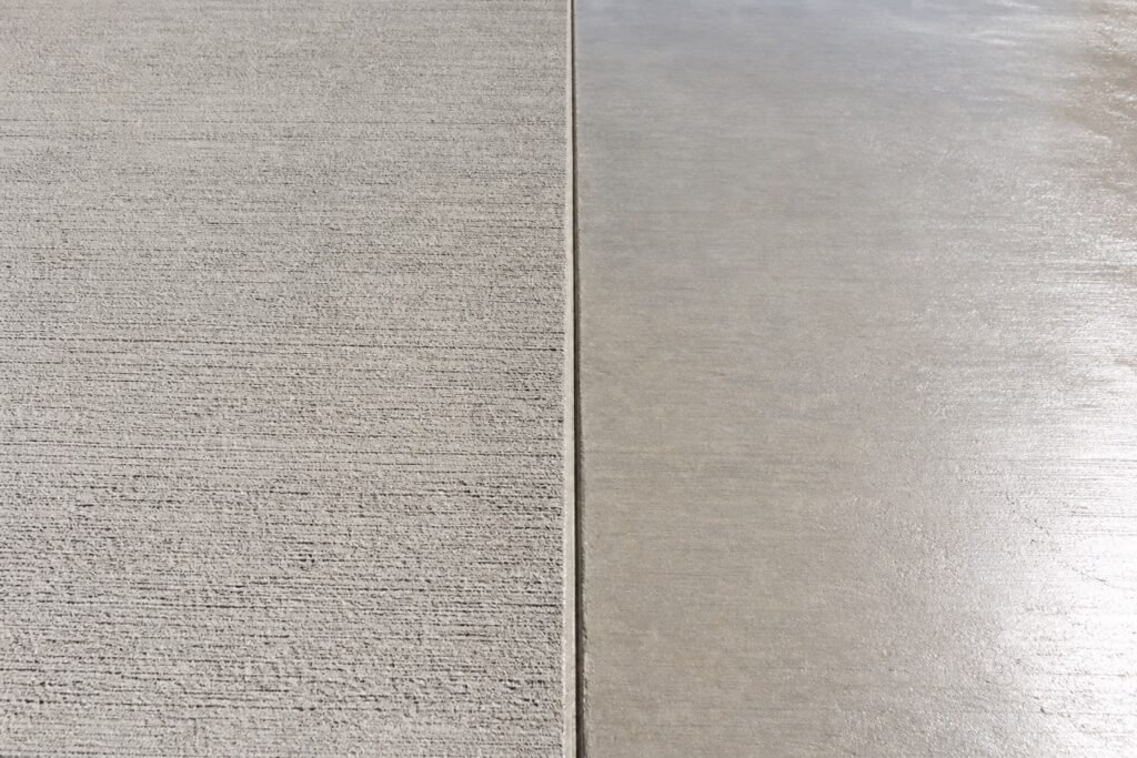 Comparison of broom finish and smooth steel-trowel finish on a concrete slab